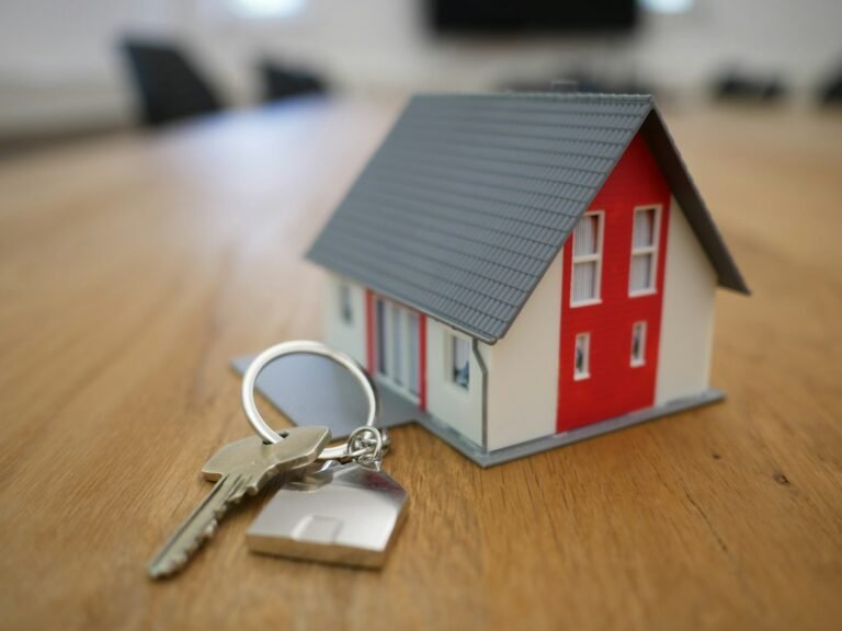 House keys next to a small model home