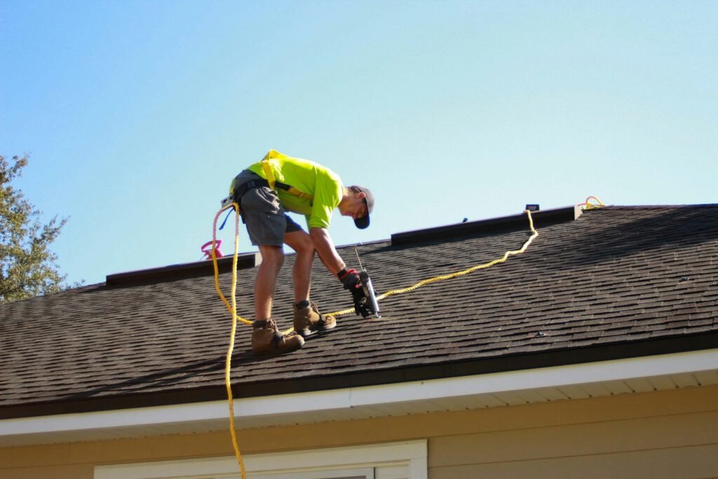 Inspector checking a shingle roof