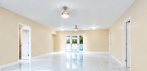 Open living area with bright tile floors
