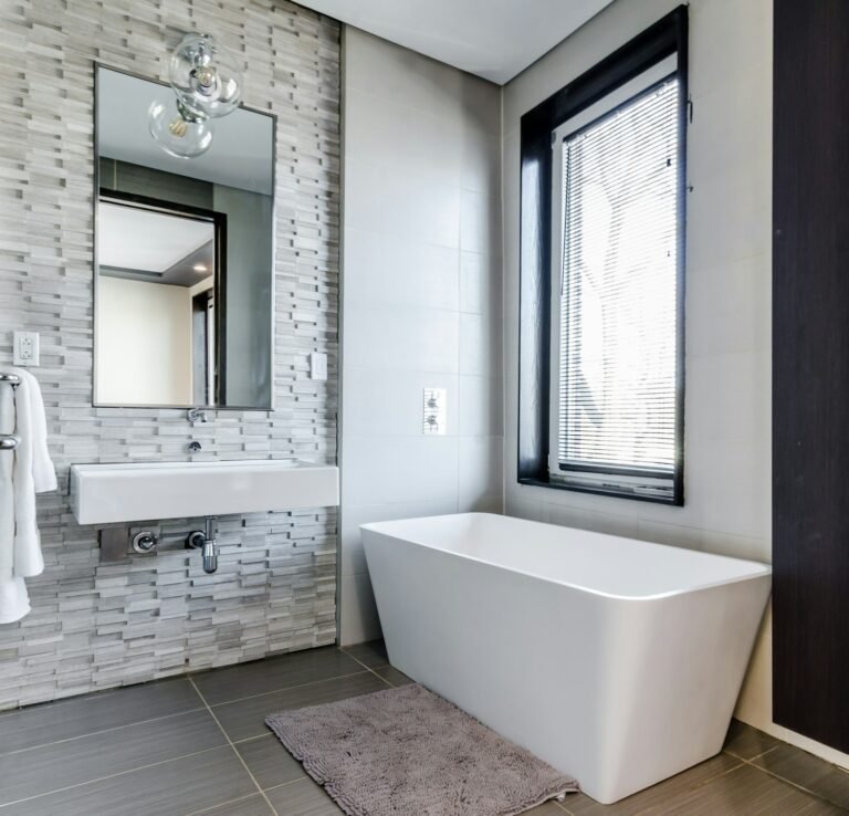 Bathtub beside a window