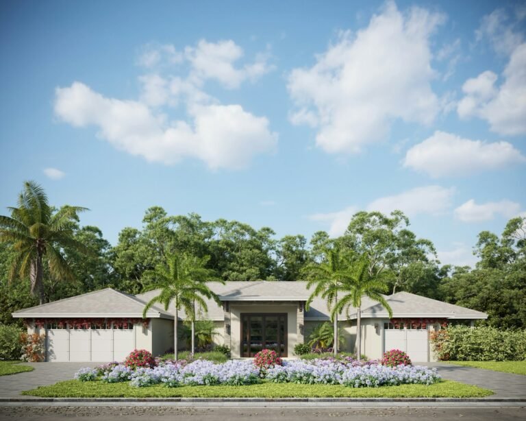 Home with palm trees and flowering plants in front