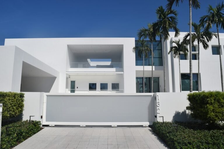 Modern white home with palm trees