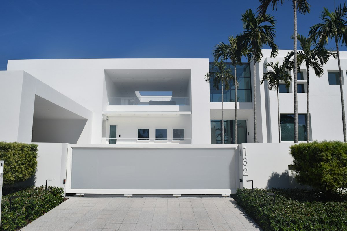 Modern white home with palm trees