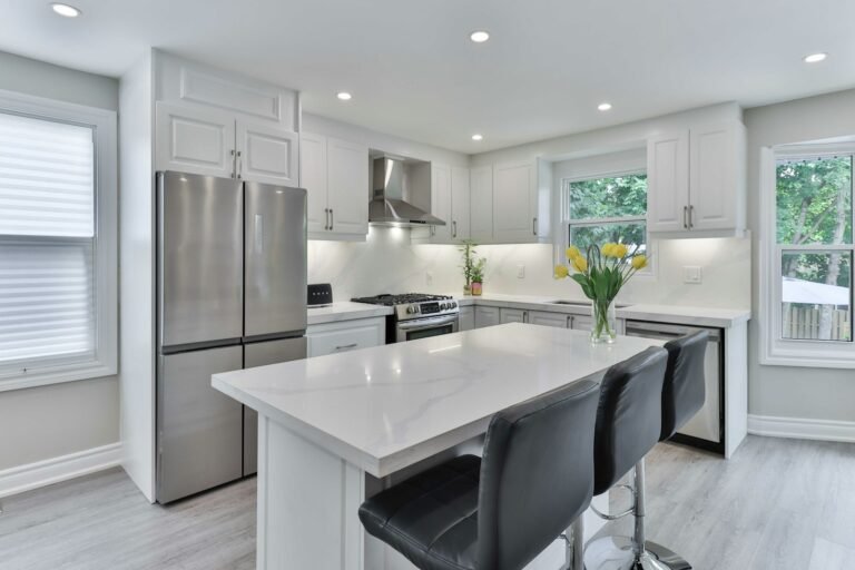 Kitchen with a sink below a window