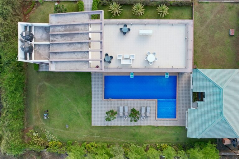 Aerial view of the home and pool